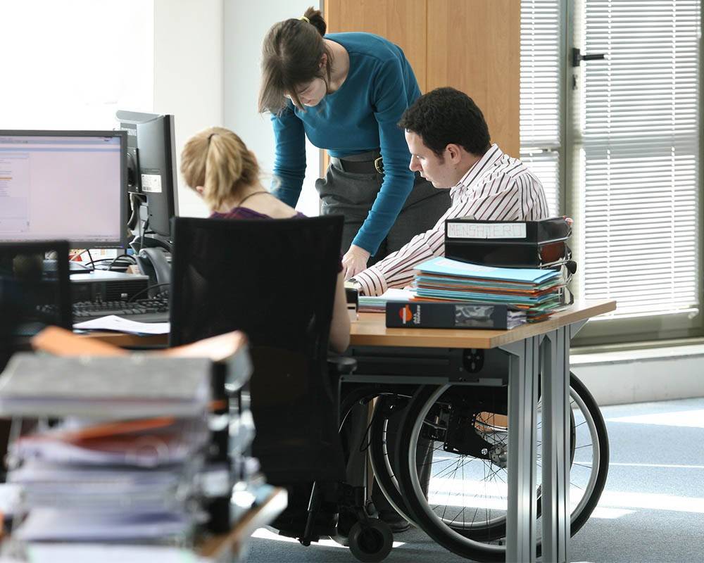 Repsol team, with one member in a wheelchair