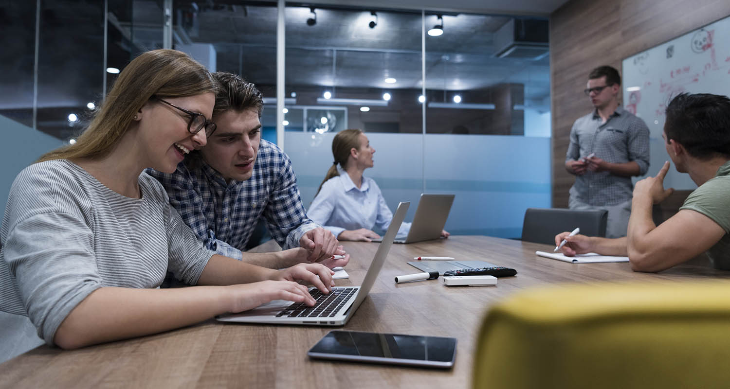 Young people in a meeting room working together