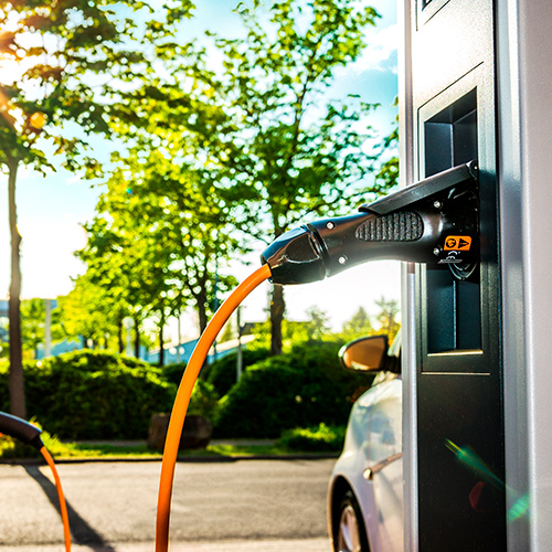 Electric car plugged into a public charging point