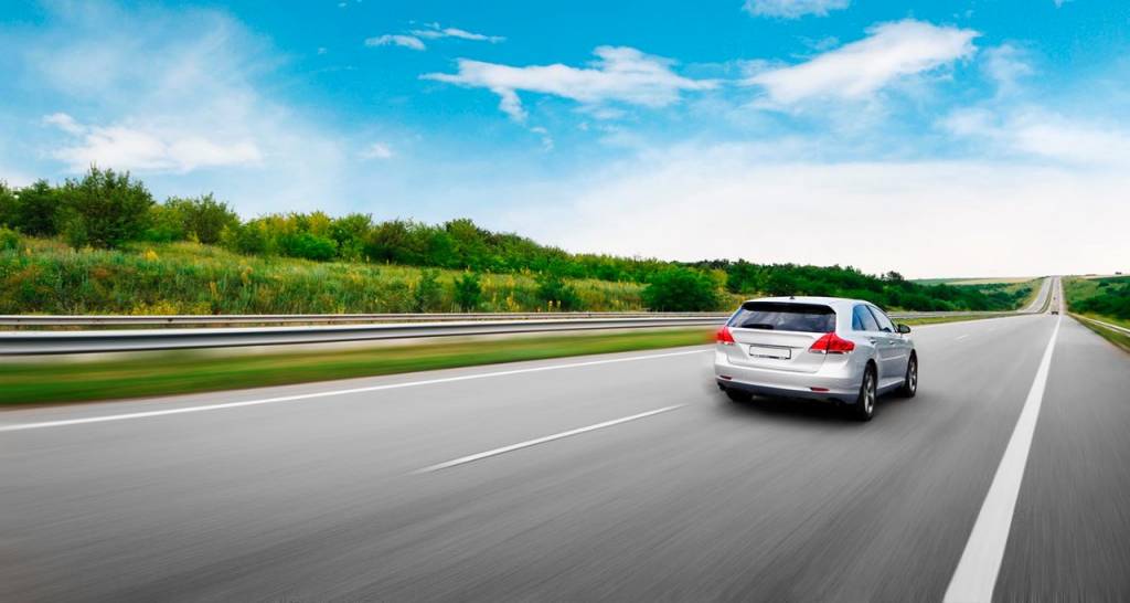 View of a car driving down the road