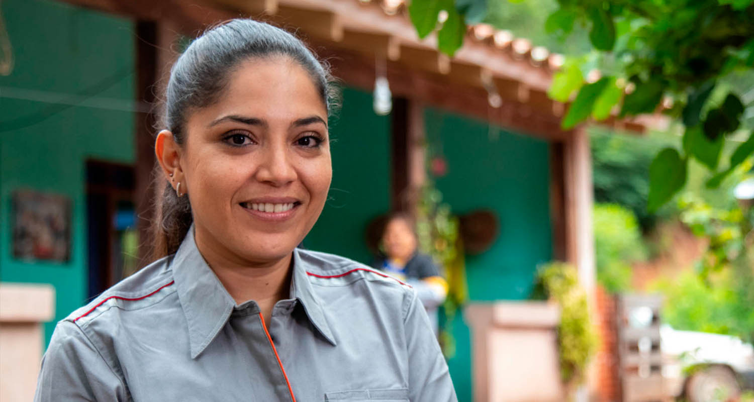 Smiling woman in grey shirt