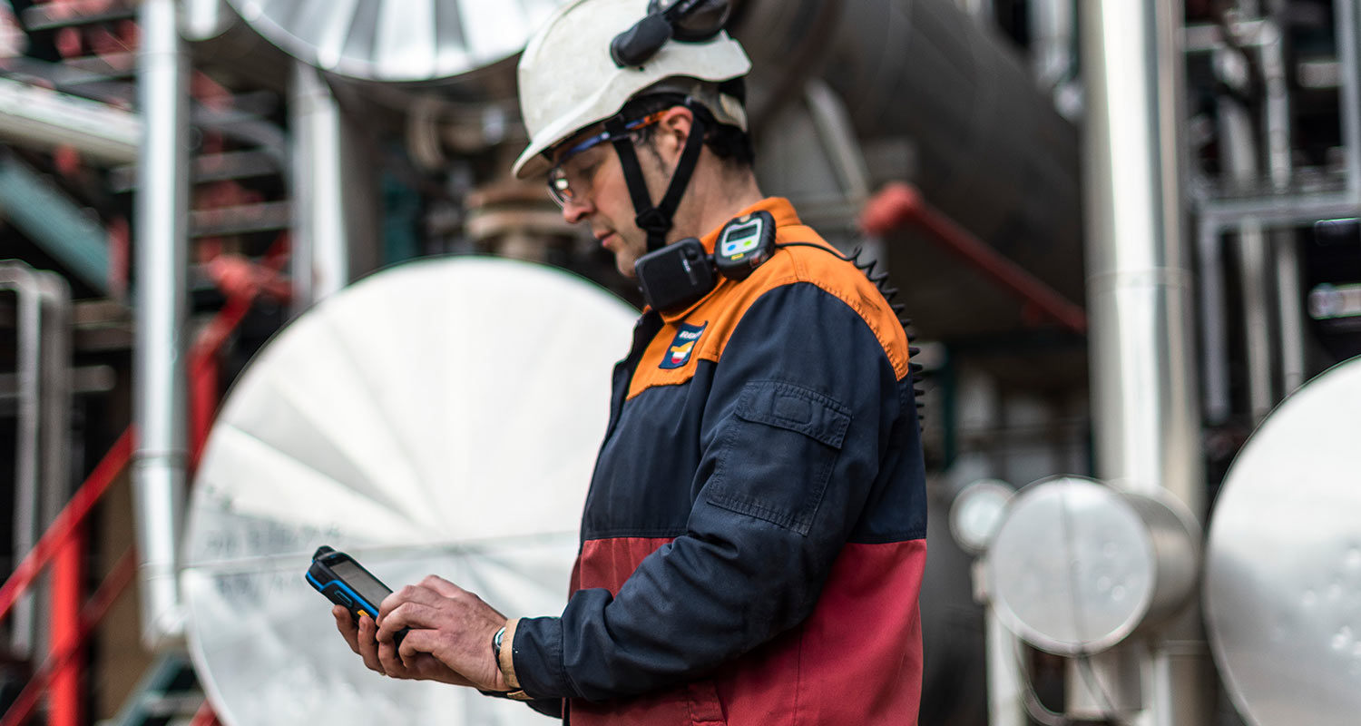 An operator wearing PPE at an industrial complex