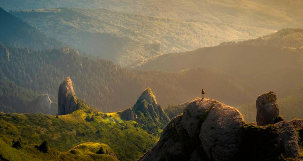 A person at the top of a mountain